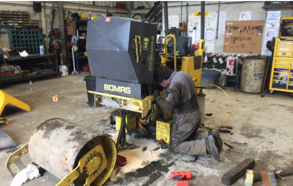 SMC Plant fitter repairing a Bomag roller